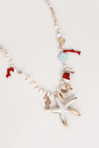 Collar de perlas con estrella de mar beige/rojo